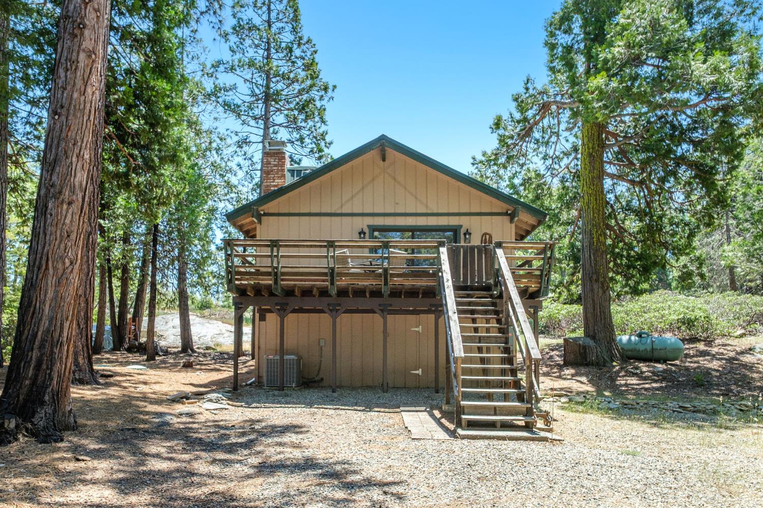 42488 Rock Ledge Road Shaver Lake, CA 93664 - Photo 5 of 26 a front view of a house with a yard