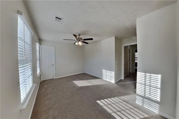 a view of an empty room and window