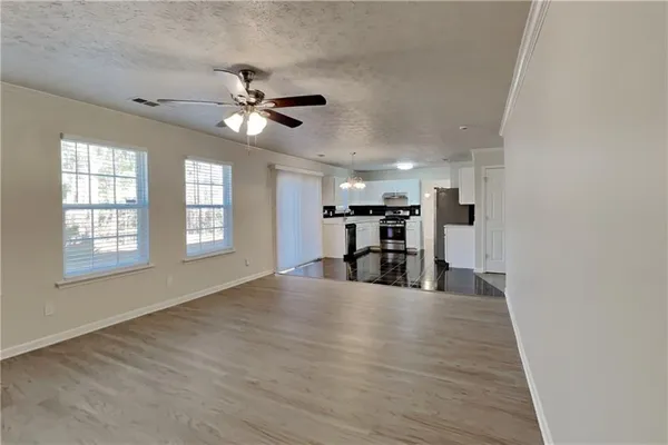 a view of a kitchen with a sink and a window