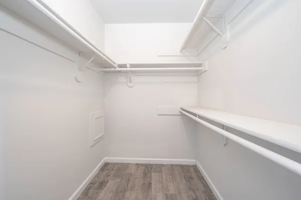 a view of an empty walk in closet