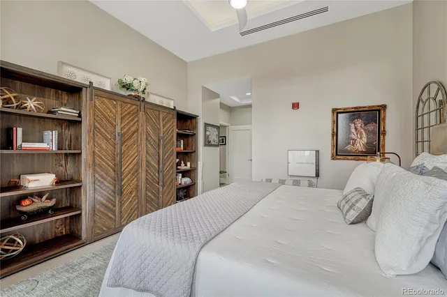 a bedroom with a bed and a closet