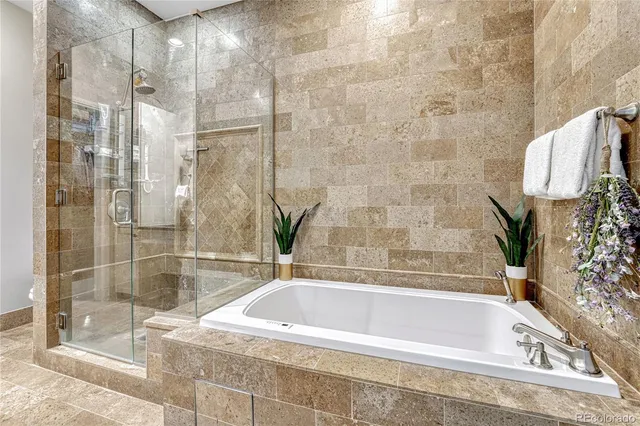 a bath tub sitting next to a shower
