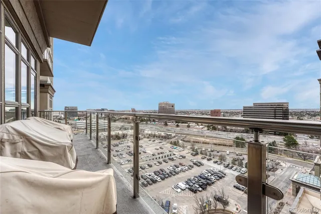 a view of roof deck with a barbeque and wooden stairs