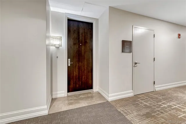 an empty room with closet and a bathroom