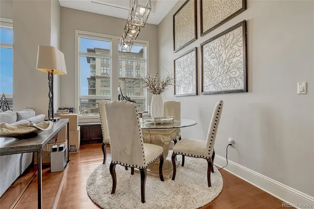 a view of a dining room with furniture window and wooden floor