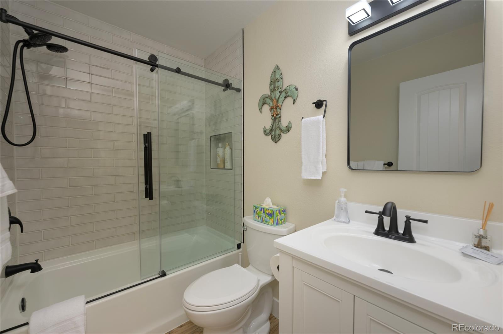 83 County Road, Unit F7 Fraser, CO 80442 - Photo 14 of 20 a bathroom with a sink toilet and shower