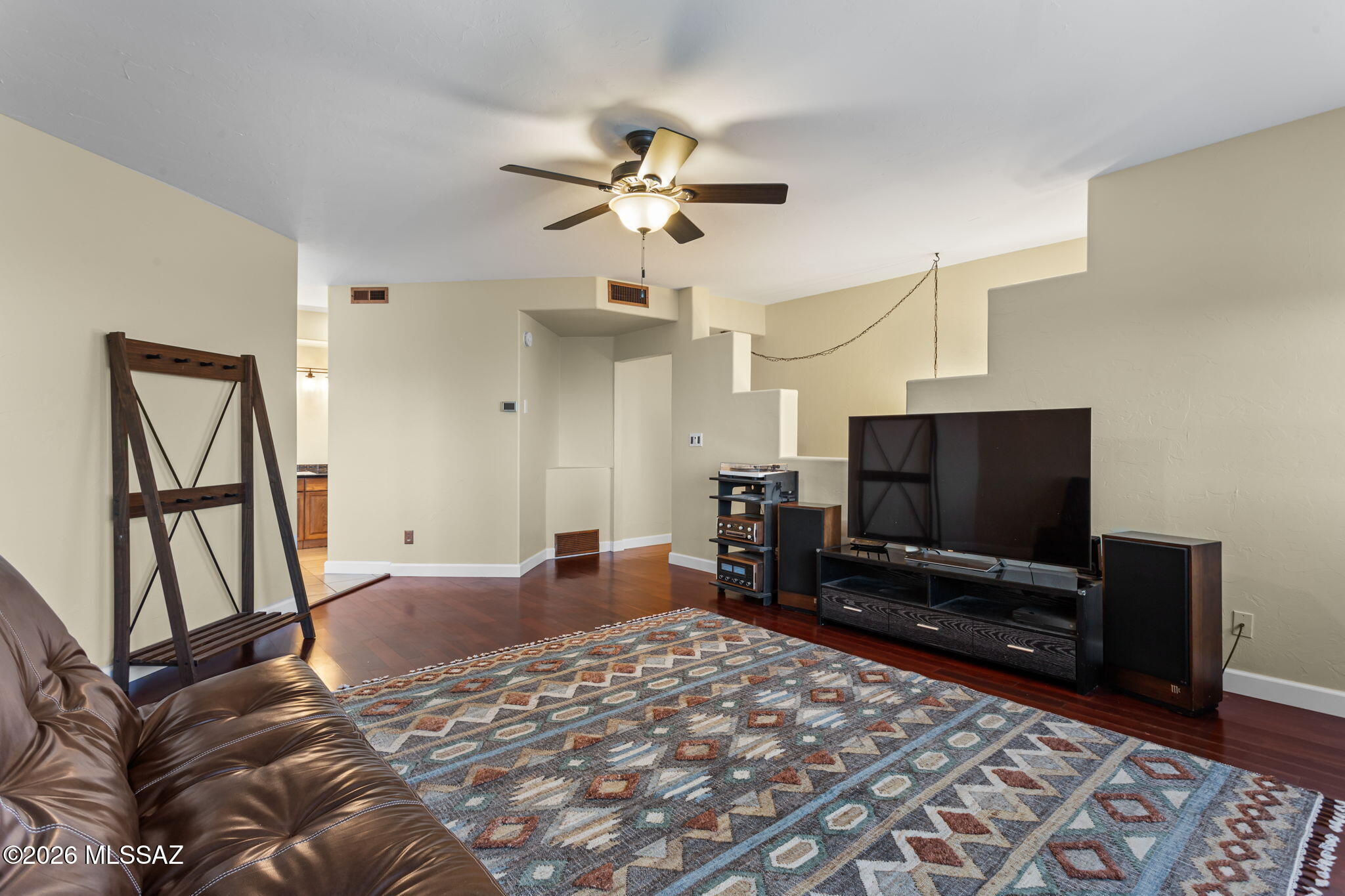 4210 West Mossman Road Tucson, AZ 85746 - Photo 18 of 51 a bedroom with a bed and a flat screen tv