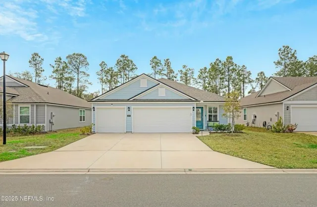 a house that has a tree in front of it