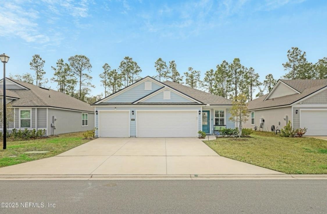 a house that has a tree in front of it