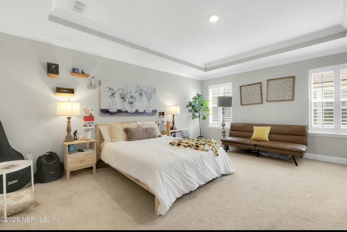 49 Narvarez Avenue St. Augustine, FL 32084 - Photo 9 of 17 a bedroom with a bed and a couch