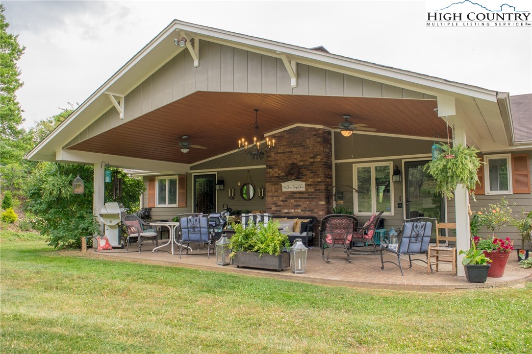 a front view of house with a garden and patio