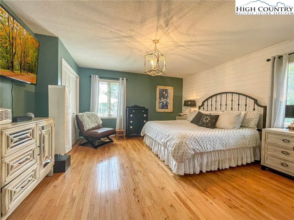4850 US Highway 421 Vilas, NC 28692 - Photo 27 of 46 a spacious bedroom with a bed and wooden floor