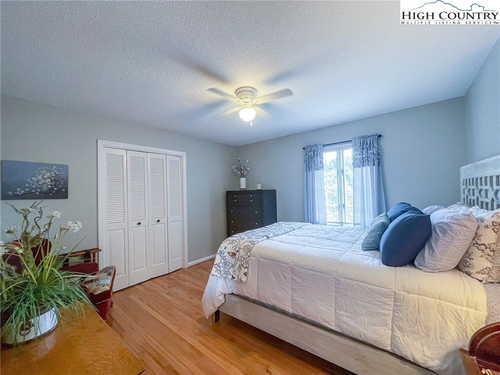 4850 US Highway 421 Vilas, NC 28692 - Photo 34 of 46 a bedroom with a bed and a potted plant