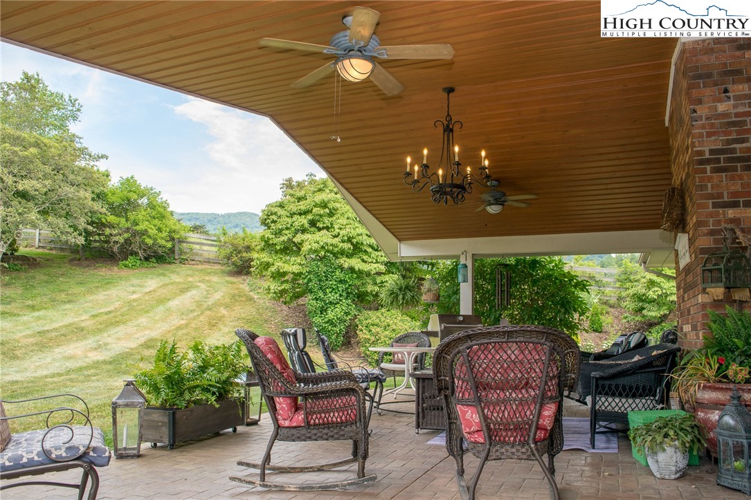 4850 US Highway 421 Vilas, NC 28692 - Photo 39 of 46 a patio with table and chairs and potted plants