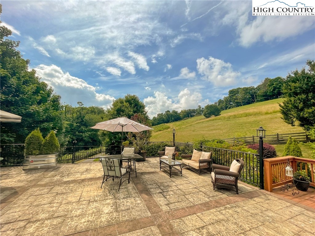 4850 US Highway 421 Vilas, NC 28692 - Photo 6 of 46 a view of a patio with furniture and a yard