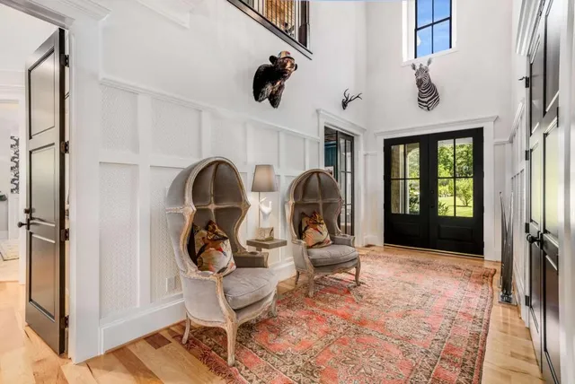 a dining room with furniture and wooden floor