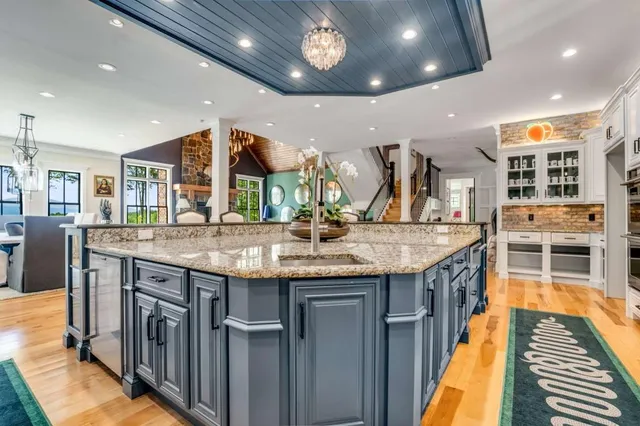 a living room with furniture and large windows