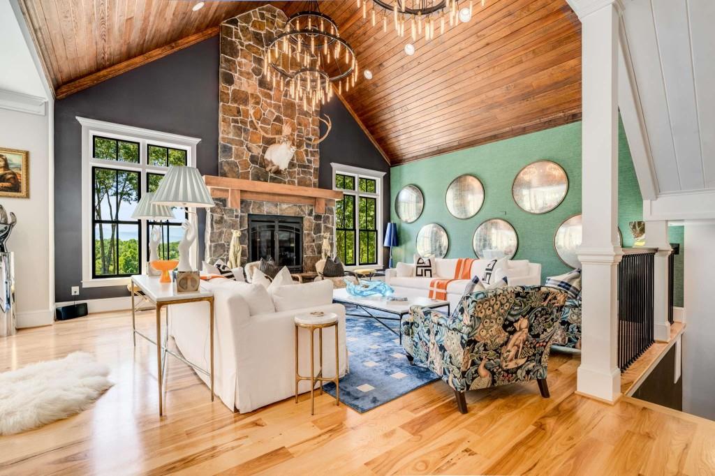 254 Nicholson Road Blue Ridge, GA 30513 - Photo 20 of 86 a living room with furniture a clock and a large window