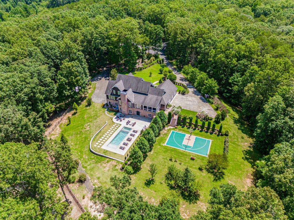 254 Nicholson Road Blue Ridge, GA 30513 - Photo 2 of 86 an aerial view of a house with swimming pool big yard and large trees