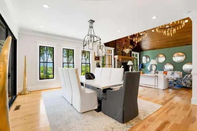 a spacious bathroom with a double vanity sink a toilet and a mirror