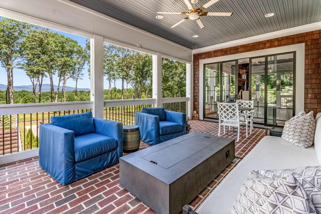 254 Nicholson Road Blue Ridge, GA 30513 - Photo 26 of 86 a living room with furniture and large windows