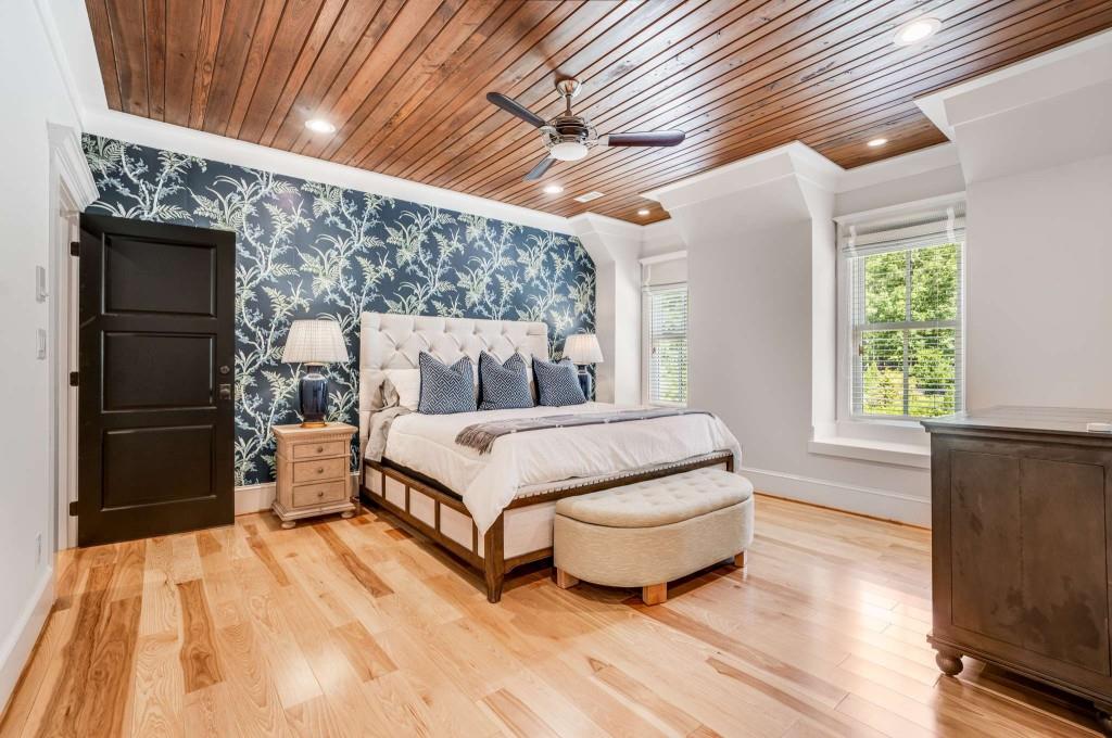 254 Nicholson Road Blue Ridge, GA 30513 - Photo 41 of 86 a bedroom with a bed and wooden floor