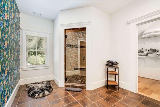 a view of a house with backyard porch and sitting area