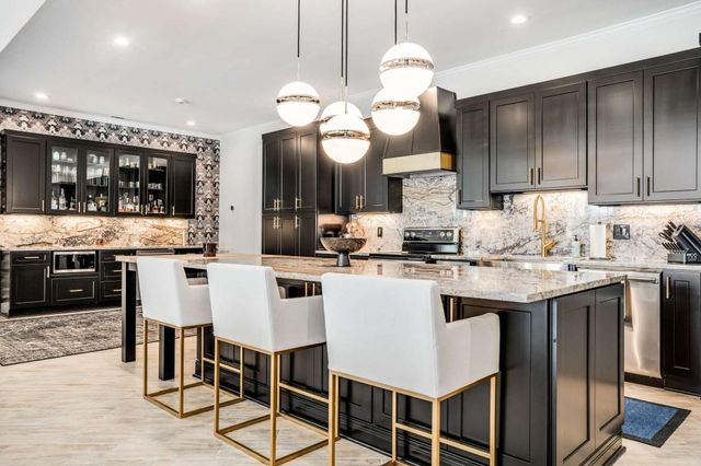 a view of a lush green field with mountains in the background