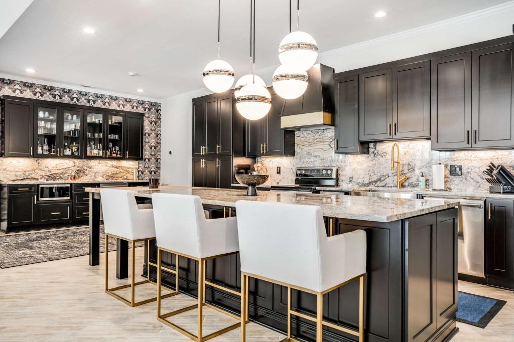 254 Nicholson Road Blue Ridge, GA 30513 - Photo 49 of 86 a kitchen with a dining table cabinets and stainless steel appliances