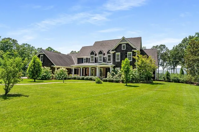 a living room with furniture a window and a fireplace
