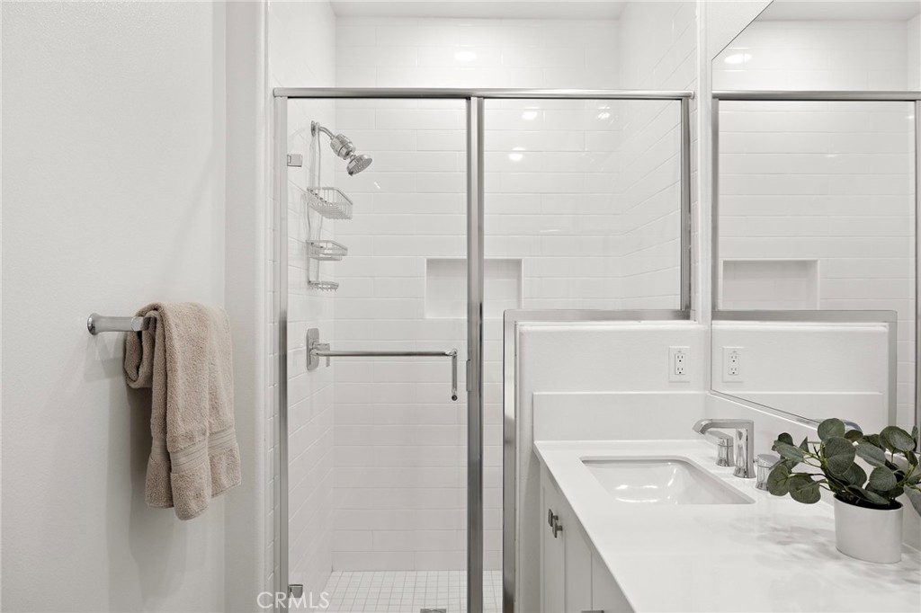 61 Wheelbarrow Road Rancho Mission Viejo, CA 92694 - Photo 17 of 74 a bathroom with a shower and a sink