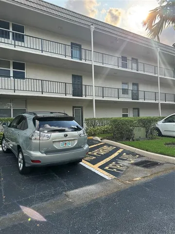 a car parked in front of a building