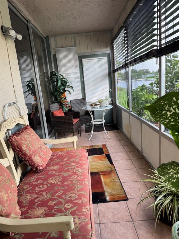 9400 Lime Bay Boulevard, Unit 112 Tamarac, FL 33321 - Photo 14 of 37 a view of swimming pool with chairs