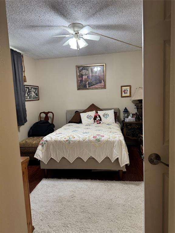 9400 Lime Bay Boulevard, Unit 112 Tamarac, FL 33321 - Photo 15 of 37 a bedroom with a bed and a chandelier