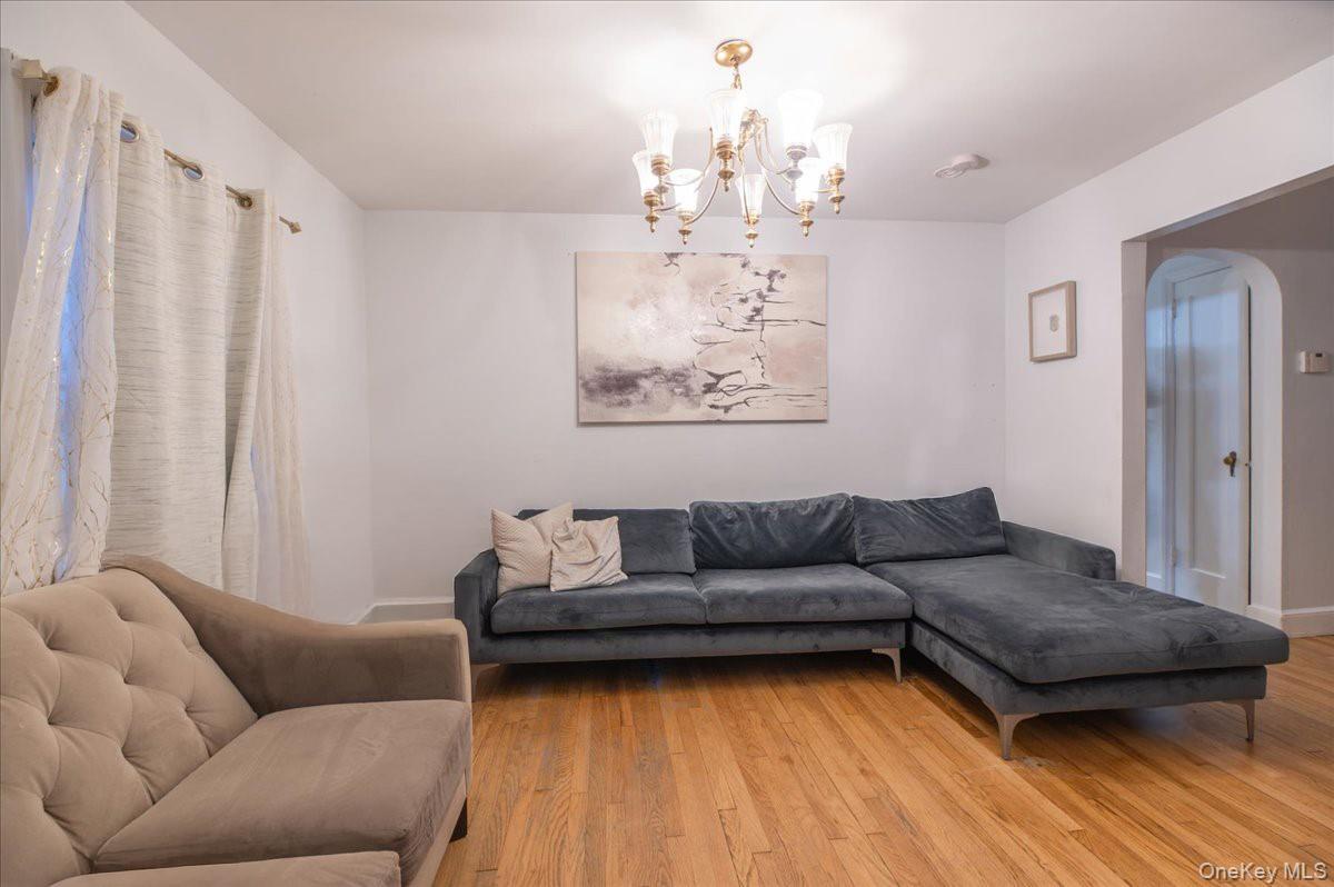 281-283 Old Haverstraw Road Congers, NY 10920 - Photo 3 of 14 a living room with furniture and a chandelier
