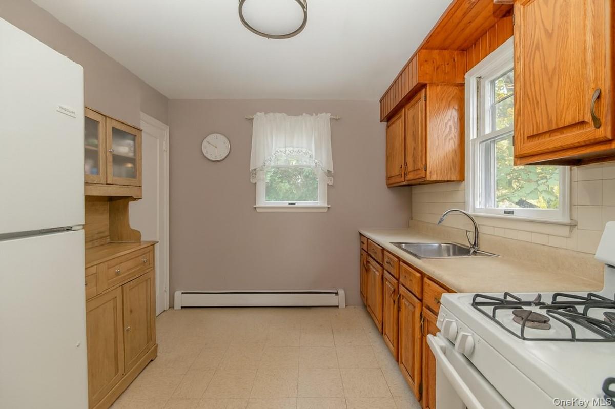 281-283 Old Haverstraw Road Congers, NY 10920 - Photo 4 of 14 a kitchen with a sink a stove and cabinets
