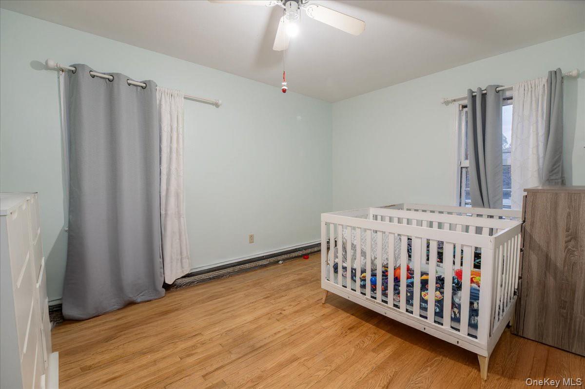 281-283 Old Haverstraw Road Congers, NY 10920 - Photo 8 of 14 a view of a bedroom with wooden floor
