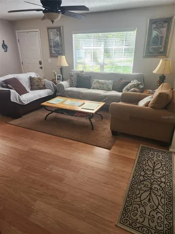 a living room with furniture and a window
