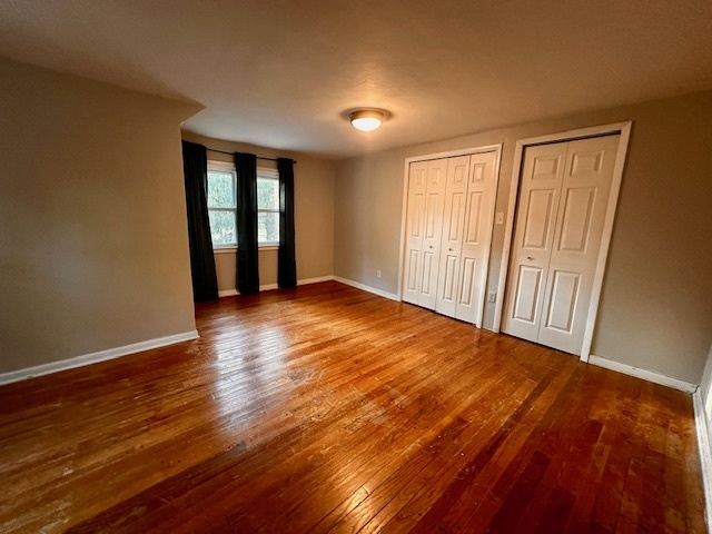 403 16th Street Mendota, IL 61342 - Photo 12 of 17 a view of an empty room with wooden floor and a window