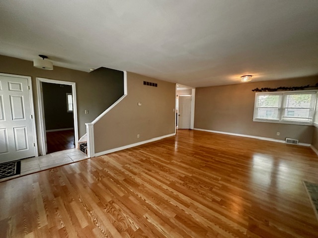 403 16th Street Mendota, IL 61342 - Photo 6 of 17 an empty room with wooden floor and windows