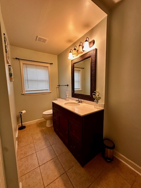 403 16th Street Mendota, IL 61342 - Photo 9 of 17 a bathroom with a sink vanity and mirror