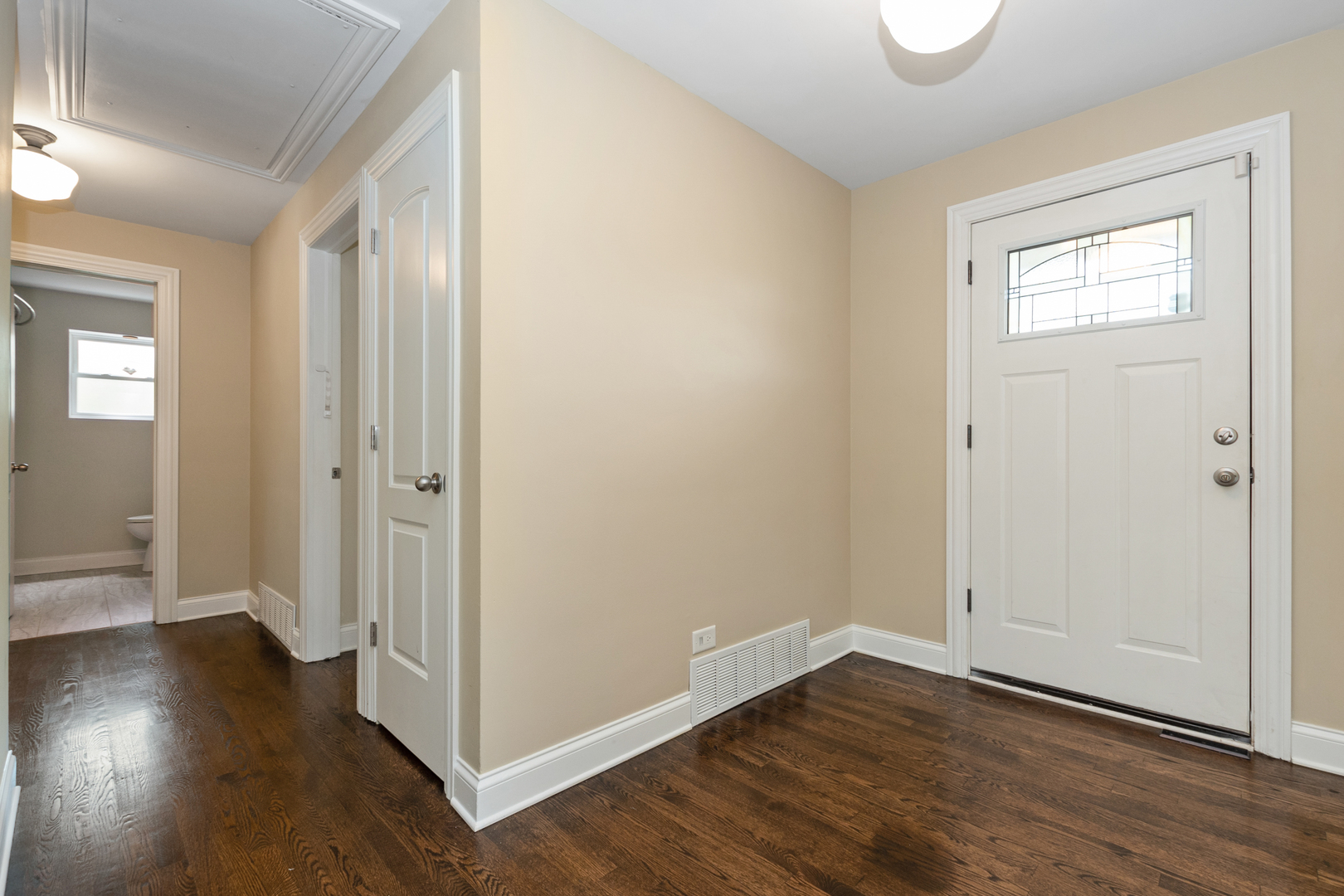 2860 Birch Road Homewood, IL 60430 - Photo 2 of 24 an empty room with wooden floor and windows