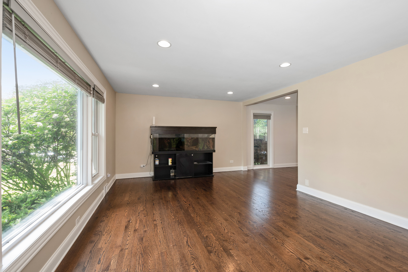 2860 Birch Road Homewood, IL 60430 - Photo 4 of 24 a view of empty room with wooden floor and fireplace