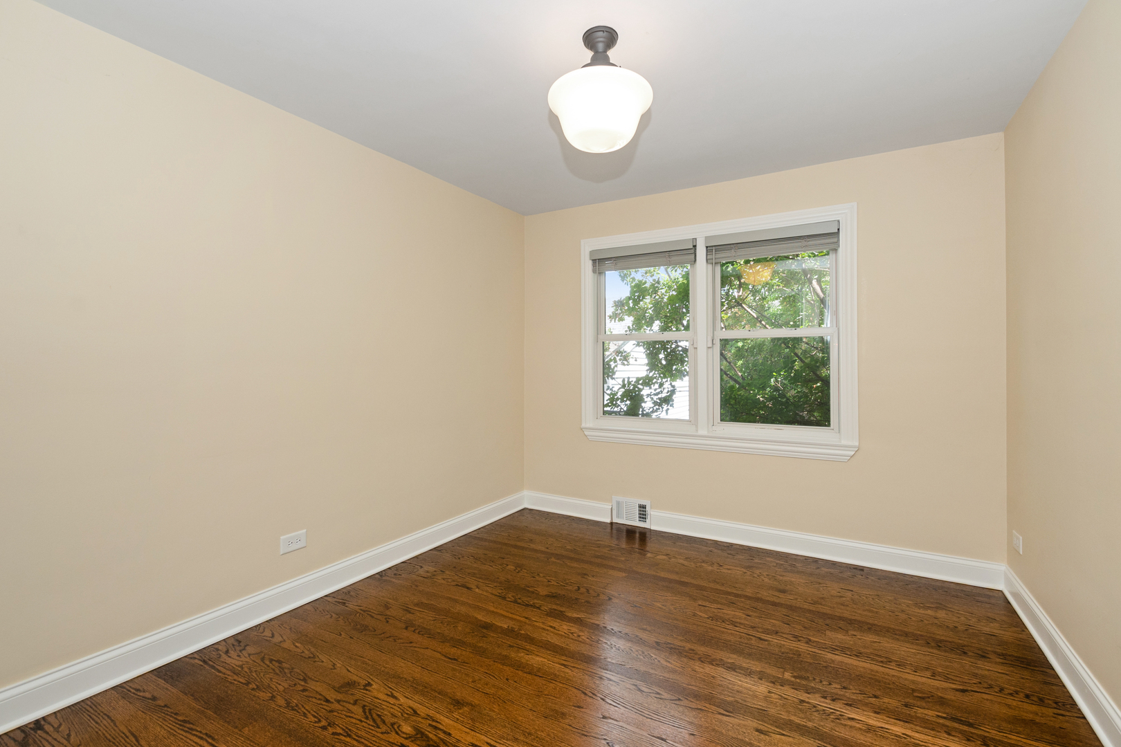 2860 Birch Road Homewood, IL 60430 - Photo 8 of 24 an empty room with wooden floor and windows