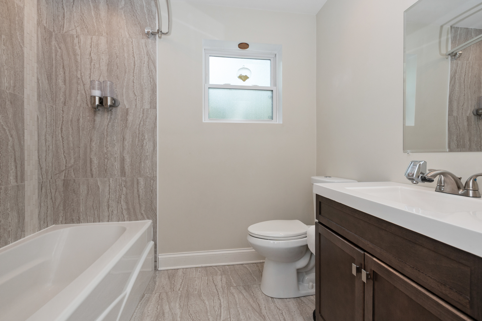 2860 Birch Road Homewood, IL 60430 - Photo 10 of 24 a bathroom with a sink a toilet and shower