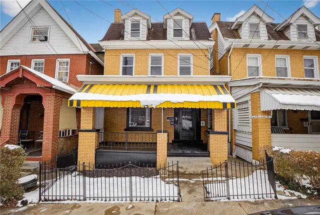 a front view of a building with glass door and glass windows