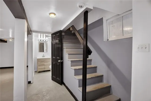 a view of entryway with stairs and wooden floor