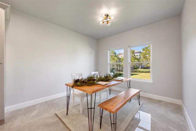 a kitchen with stainless steel appliances granite countertop white cabinets and a stove