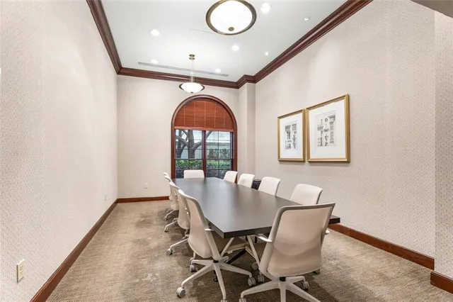 a view of a dining room with furniture and a window