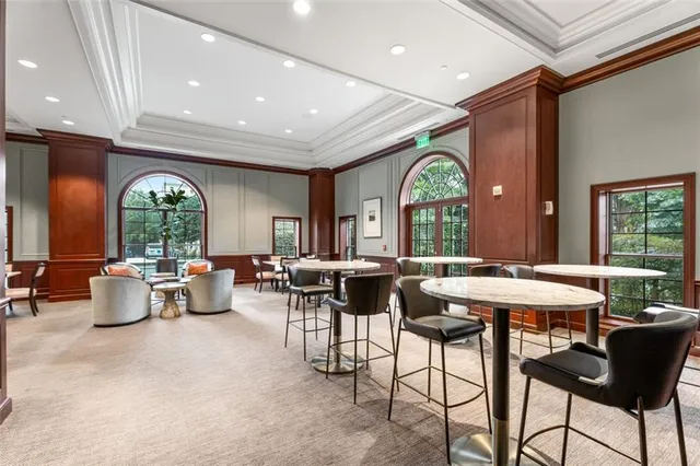 a very nice looking living room with furniture and a large window
